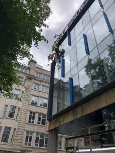 high level glass replacement with floor crane